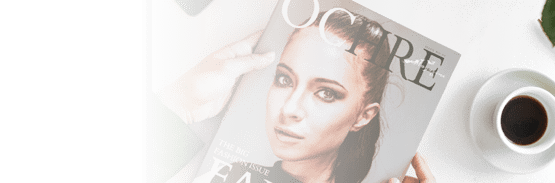 Hands holding a fashion magazine